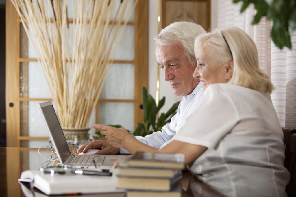older couple studying computer